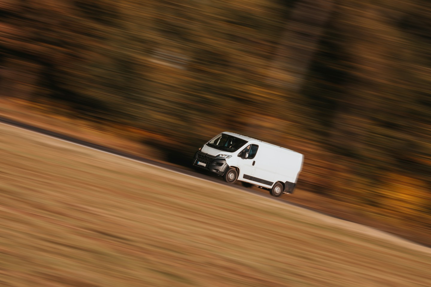Delivery van photographed travelling along a road